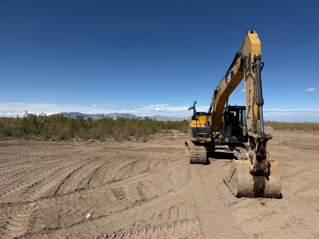 Image of excavator at Ogden Bay Waterfowl Management Area. 
